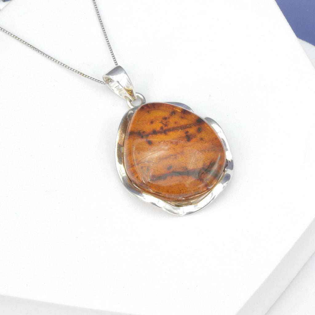 Sterling Silver Amber Pendant w/ Wavy Setting