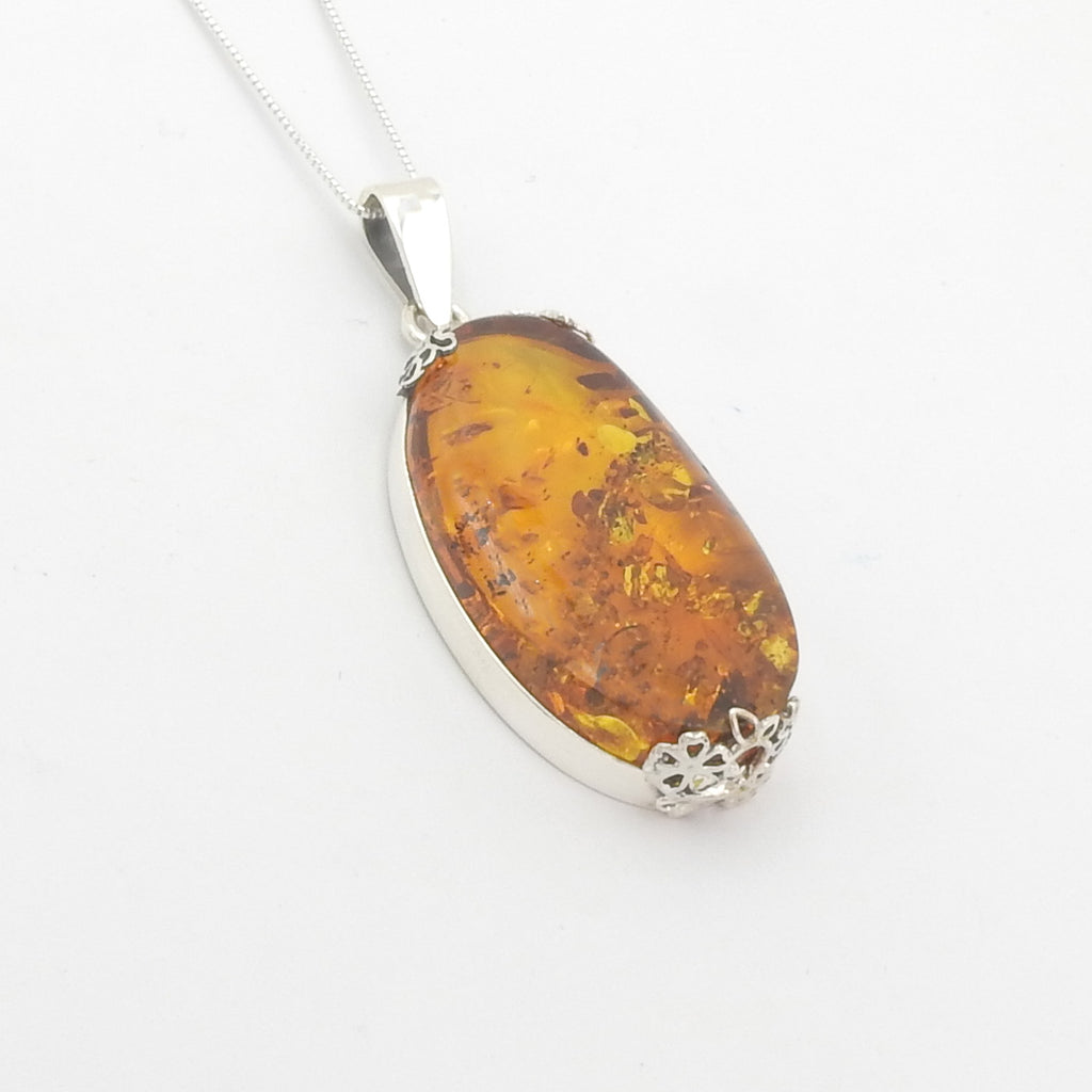 Sterling Silver Amber Pendant w/ Floral Detail